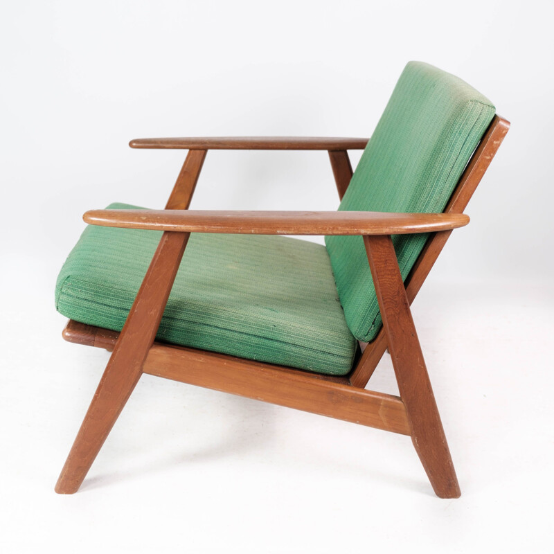 Vintage Danish armchair in teak and with green upholstery, 1960s