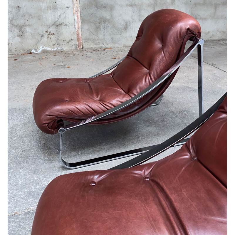Paire de fauteuils vintage inoxydable et cuir capitonné par Roche&Bobois,  1970