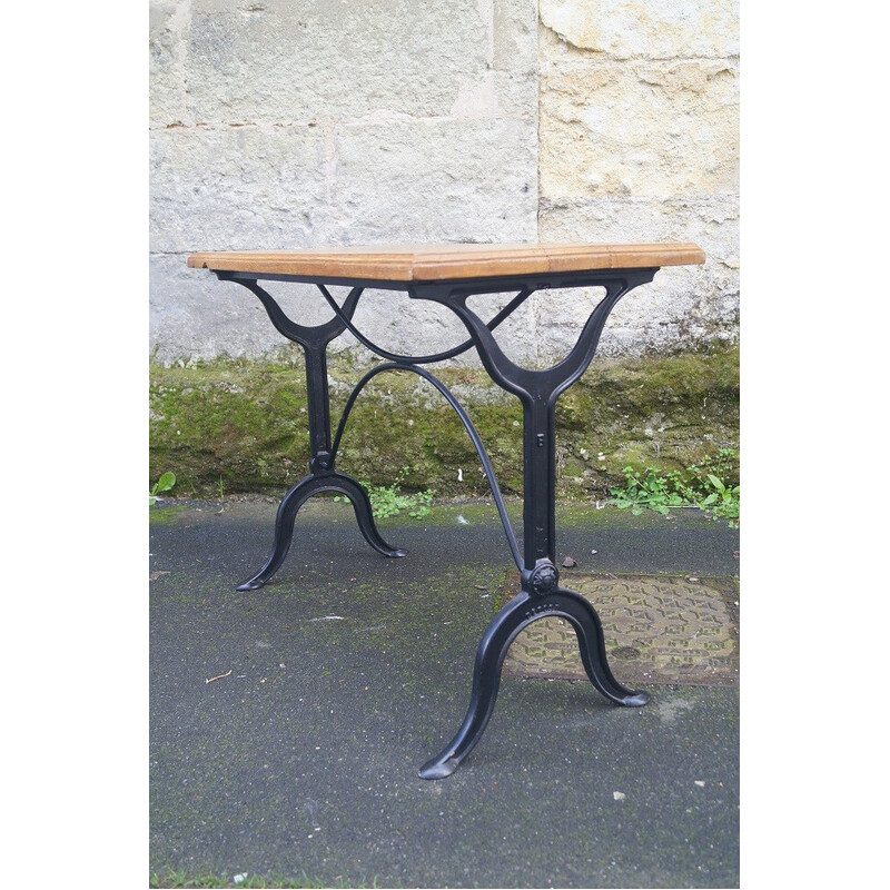Vintage bistro table in solid oakwood and cast iron, France 1950s