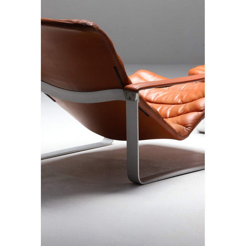 Vintage lounge chair with ottoman in aluminum and dark cognac leather by  Ilmari Lappalainen for Asko,