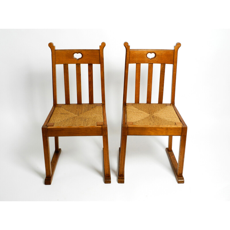 Coppia di sedie vintage in legno di quercia con piedini a slitta e sedute  in vimini