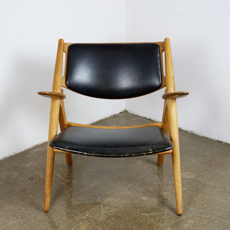 Vintage Ch28 lounge chair in oak and black leather by Hans Wegner for Carl  Hansen, Denmark