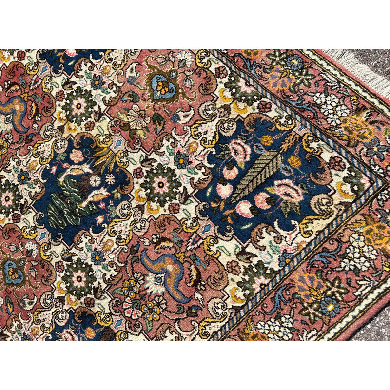 Vintage oriental hand-knotted wool rug with bird decoration, 1970