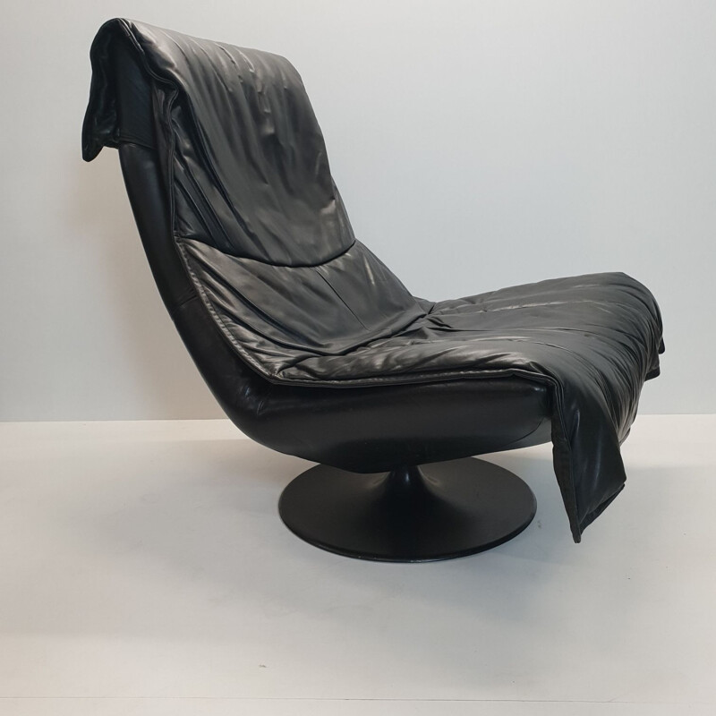 Vintage Dutch swivel armchair and ottoman in black leather